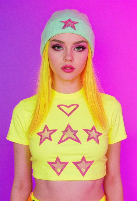 fire, teeth, star (symbol), spoken heart, 
full torso photo of a cute girl, solo, small neon color beads in hair, colorful hair accessories, confident pose, layered neon color streetwear outfit, (crop top tshirt:1.2), neon color hairstyle, high-fashion portrait, avant-garde look, 1girl, very pale skin, platinum blonde hair, asymmetrical haircut, dramatic bangs obscuring eyes, edgy beauty, slender petite build, long straight (neon color hair), black eyeliner, heavy mascara, bold neon color lips, (neon color beanie), mysterious aesthetic, 
fashion editorial lighting, vibrant tone lighting, fashion photography style, edgy aesthetic, modern alt look, high detail, cinematic sharpness, 
solid neon color background,
high detail, high resolution, high-resolution fashion editorial, expressive lighting, vibrant colors, creative composition
 <lora:dmd2-sdxl-4step:1> <lora:sm0k-000006:1> <lora:neoncolors2:0.6>
