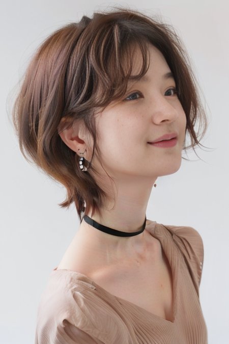 (1girl), (best quality), (masterpiece), (high resolution), (intricate details), (photorealistic), (cinematic light),  <lora:short_hair:0.8>, korean girl,
solo, brown hair, nape, blurry, upper body, blurry background, wavy hair, smile,  realistic, looking at viewer, lips, upper body, off shoulder, shirt
white background, upper body, brown eyes, closed mouth,  profile, lips, nose, portrait, earrings, parted lips, black choker, ear piercing
sleeves past wrists, simple background ,