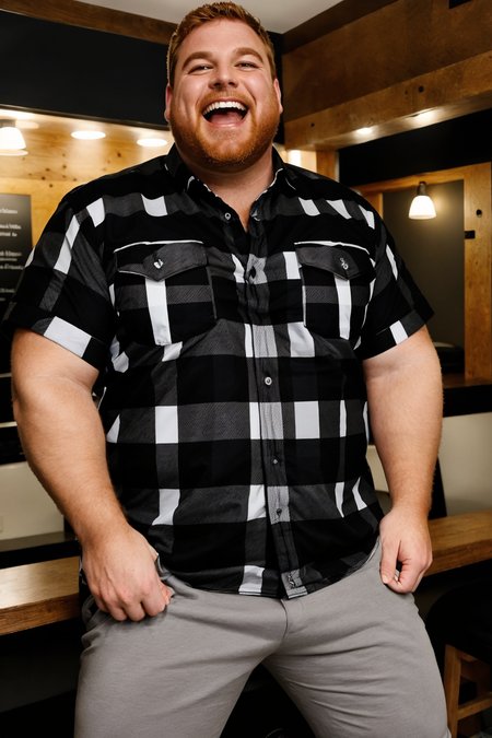 dg_Tuck, handsome man in a pub, (black plaid shirt:1.2), khakhis, (laughing:1.2), sitting <lora:dg_Tuck_v1:1>  <lora:weight_slider_v2:0.5>
