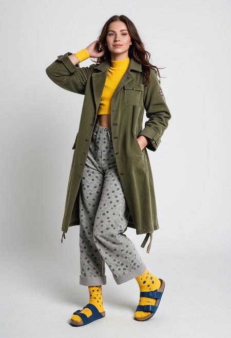 (realistic photograph of woman wearing socks sandals trousers coat), 1girl, solo, dynamic_pose, simple_background, white_background, scksnsndls, patterned blue and yellow socks, gray trousers, red and green coat, full_body, birksonsocks, birkenstock