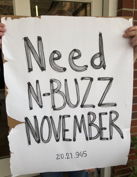 decayart, sign written "Need N-BUZZ NOVEMBER"
