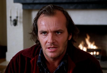 Jack Torrance, closeup, crazy evil look, powerful, Overlook Hotel, lounge, fireplace in background, indoors, highly detailed, 4K, (grainy analog 35mm photo)