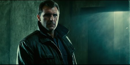 Dark Fantasy Art of  <lora:Blade Runner Style:1>
Kodak Eastman 100T 5247 Cinematic 1982 Film Stock Footage of Rick Deckard a scared man standing in a dirty room behind a wall with window shaft light ray light on staring at something to the left with a scared look on his face Blade Runner style, dark, moody, dark fantasy style