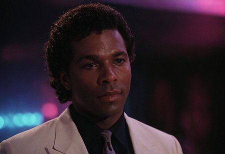 cinematic film still (Rico Tubbs), MiamiVice, indoors, club, neon lights, closeup . shallow depth of field, vignette, highly detailed, high budget, bokeh, cinemascope, moody, epic, gorgeous, film grain, grainy
