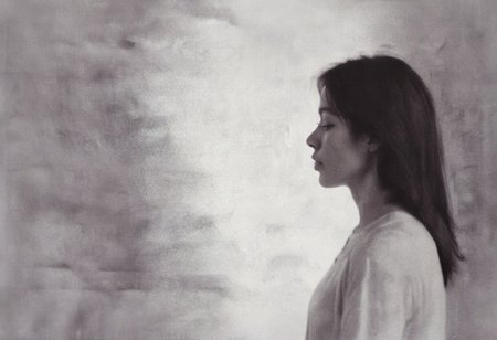 an aesthetic, minimalist depiction of a female profile in side view. The focus is on the soft contours and calm, monochromatic tones. The scene feels mystical and dreamy, almost as if viewed through a delicate mist, with gentle light accentuating the silhouette. The background is diffuse and creamy white, drawing attention to the elegant simplicity of the figure.