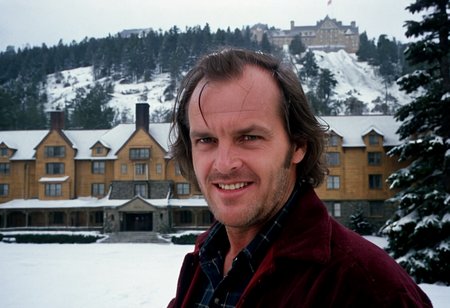 Jack Torrance, closeup, evil grin, Overlook Hotel in background, pine trees, snow, outdoors, highly detailed, 4K, (grainy analog 35mm photo)
