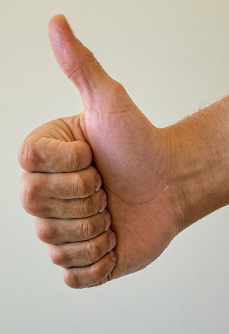 close up photo of a thumbs up