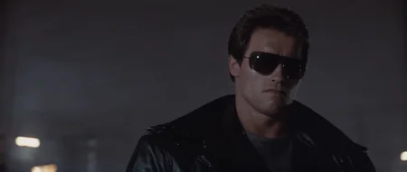 cinematic film still of  <lora:Terminator style:0.8>
In the 1980's Terminator a man in a leather jacket and sunglasses,solo,shirt,black hair,1boy,jacket,upper body,male focus,open jacket,black jacket,facial hair,sunglasses,realistic,leather,leather jacket , horror themed, dark themed, low key light, dramatic light, dramatic shadow light, contrast, cinematic color, cinematic look, filmic, realistic, realism, perfection, perfect, Kodak, Kodak film, movie still, Terminator style, The Terminator 1984 Film style, shallow depth of field, vignette, highly detailed, high budget, bokeh, cinemascope, moody, epic, gorgeous, film grain, grainy