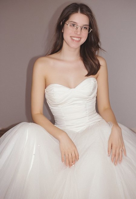 realistic photo of Beautiful young woman, perfect medium perky natural breasts, 2009 style, low rise, low contrast style, 8mm film, analog photography style, long brown hair, sharp facial features,thick nerdy glasses, pale white skin, , influencer, brown eyes, no makeup, instagram, detailed skin texture, detailed eyes, detailed face, slim, (small waist, wide hips, thick thighs:1.2), (sexy wedding gown with pink highlights:1.3), happy, smiling, juicy ass,