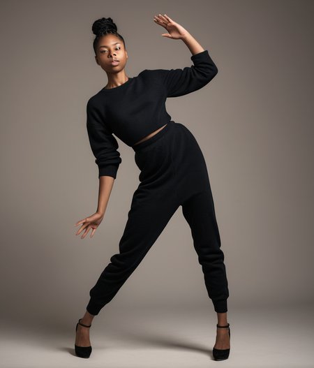 full length scandinavian black young woman in strange pose. best face, best hands, <lora:strange_poses:1.2>
