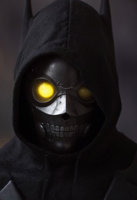 vibrant yellow cyberpunk jacket, solo, batman, mechanical parts, portrait, dark-red liquids, tanktop, looking back, white eyes, monochrome, half face is made of technical parts and wires, large eerie linen hood, atmospheric haze, Film grain, cinematic film still, shallow depth of field, highly detailed, high budget, cinemascope, moody, epic, OverallDetail, 2000s vintage RAW photo, photorealistic, candid camera, color graded cinematic, eye catchlights, atmospheric lighting, imperfections, natural, shallow dof