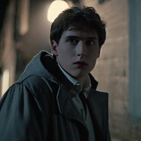 Horror-themed,  <lora:Fright Night 1985 Film Style:1>
Cinematic Closeup Shot Film Footage captured by Panavision Cameras and Lenses, Evil Ed a young man with a profile face view in a dark jacket staring at something in the left outdoors in a dark alley with perfect cool white moonlight shadow light dramatically lighting his face Fright Night 1985 Film Style, Eerie, unsettling, dark, spooky, suspenseful, grim, highly detailed