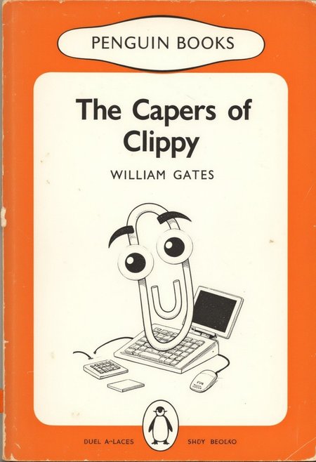 The image is a photograph of a book cover, The image is a photograph of a book cover "The Capers of Clippy" by William Gates, vivid orange band at the top and bottom, rounded-corner design with a white panel at the top bearing the Penguin Books logo in bold, sans-serif letters in the center of the cover.  On the cover is an illustration of clippy with big eyes and a computer keyboard.