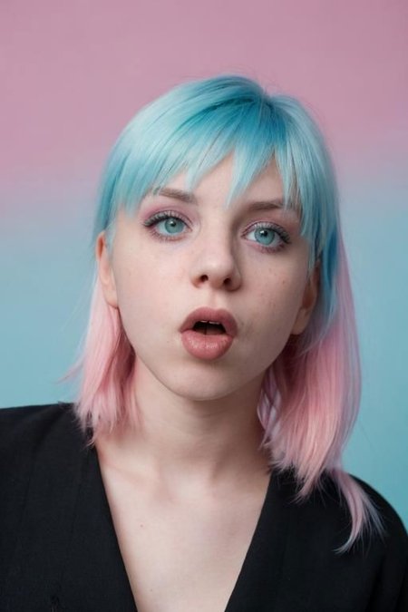 Film still, cinematic, flash photography, 2005 cute emo woman, suprised, open mouth, scene girl, pastel hair, vibrant pastel blue background, sharp focus, detailed skin texture, detailed eyes,