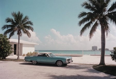 analog film photo MiamiVice . faded film, desaturated, 35mm photo, grainy, vignette, vintage, Kodachrome, Lomography, stained, highly detailed, found footage