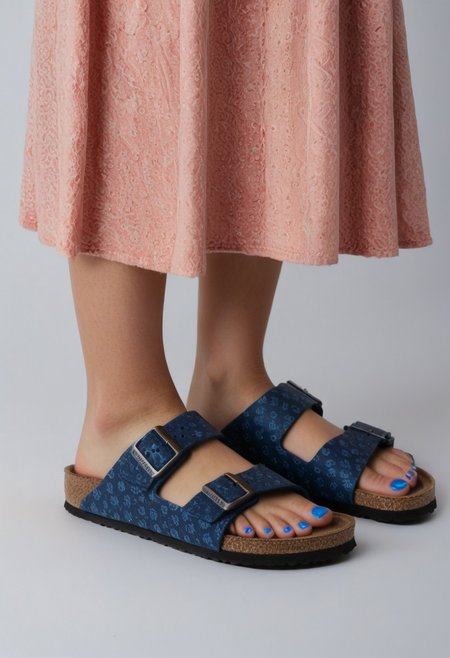 1girl, solo, simple_background, white_background, birksonfeet, blue_toenail_polish, close-up, lower_body, footwear_focus, patterned, long_skirt