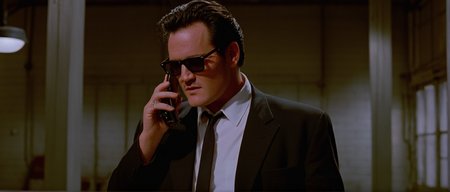 cinematic film still of  <lora:Reservoir Dogs style:1>
Michael Madsen, Cinematic 1992 image focus of Cinematic 1992 image focus of a man in a suit and tie holding a cell phone,solo,short hair,shirt,black hair,long sleeves,1boy,holding,jacket,white shirt,male focus,belt,pants,indoors,cup,black jacket,black pants,formal,sunglasses,suit,holding cup,watch,hand in pocket,drinking,wristwatch,Kodak film grain,dramatic light,dramatic shadow light,contrast,saturated color,cinematic,filmic,motion picture,realistic,realism,perfection,perfect,deep focus,clean image , Kodak film grain, dramatic light, dramatic shadow light, contrast, saturated color, cinematic, filmic, motion picture, realistic, realism, perfection, perfect, deep focus, clean image, Reservoir Dogs style, Reservoir Dogs 1992 Film style, shallow depth of field, vignette, highly detailed, high budget, bokeh, cinemascope, moody, epic, gorgeous, film grain, grainy