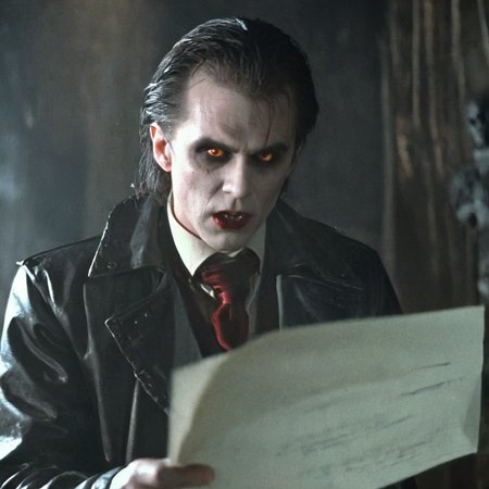 Horror-themed,  <lora:Fright Night 1985 Film Style:1>
Cinematic Medium Shot Film Footage captured by Panavision Cameras and Lenses, vampire creature, Evil Ed a profile face of a messy hair vampire in a black jacket and a forehead wound, with a creepy face and vampire teeth, holding and reading a piece of paper in a dark room with perfect dramatic light on, Fright Night 1985 Film Style, Eerie, unsettling, dark, spooky, suspenseful, grim, highly detailed