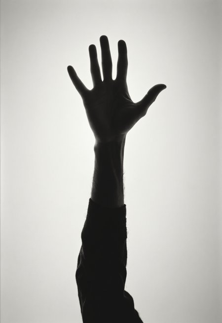 a shadow of a person reaching up to a hand with their arms extended out in the air, with a white background, Bert Stern, liminal space, a photocopy,