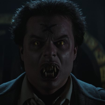Horror-themed,  <lora:Fright Night 1985 style v2:0.9>
In the 1980's Cinematic Closeup Shot Film Footage captured by Panavision Cameras and Lenses,vampire creature,Stephen Geoffreys as "Evil Ed" a young vampire creature with a vampire face and  golden eye lenses and a "cross mark" on his forehead screaming in front of camera with creepy fangs teeth and open mouth Fright Night 1985 Film Style,solo,looking at viewer,short hair,open mouth,simple background,black hair,1boy,brown eyes,yellow eyes,male focus,teeth,fangs,scar,black background,portrait,realistic , horror themed, dark themed, low key light, dramatic light, dramatic shadow light, contrast, cinematic color, cinematic look, filmic, realistic, realism, perfection, perfect, Kodak, Kodak film, movie still, Fright Night 1985 style, Fright Night Film style, Eerie, unsettling, dark, spooky, suspenseful, grim, highly detailed