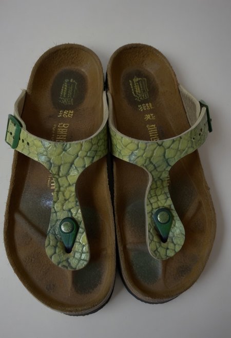 still_life, no_humans, simple_background, white_background, gizeh, gizehunworn, close-up, footwear_focus, patterned, orange-green-red, worn_shoes, worn_insoles, smelly_shoes