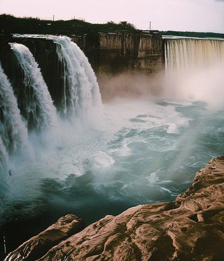 niagra falls waterfalls, (((vintagehelper))), depth of field, bokeh, wide angle, dramatic lighting, lens flare