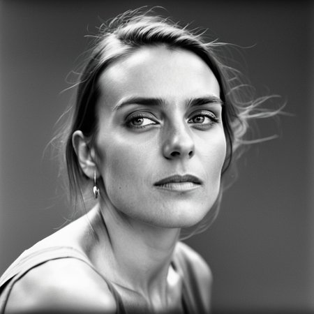 kiev80 A breathtaking, high-end black-and-white portrait of a 25-year-old woman, a vision of natural beauty and effortless elegance. Her face is the absolute focal point—her deep, expressive eyes radiate warmth and mystery, while her delicate features and flawless skin are illuminated by masterful chiaroscuro lighting. Every detail is captured with precision: the gentle curve of her lips, the soft glow on her cheekbones, and the way the light and shadow sculpt her face, creating a timeless, almost cinematic allure. Her expression is both captivating and inviting, evoking a sense of intimacy and admiration. The background is minimalist and softly blurred, ensuring undivided attention on her radiant presence. Inspired by the iconic works of Peter Lindbergh, Richard Avedon, and Helmut Newton, this portrait exudes sophistication, depth, and an irresistible charm that makes her unforgettable.