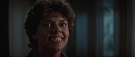 cinematic film still of  <lora:Fright Night 1985 style v2:1>
In the 1980's Amy Peterson Amanda Bearse a woman with a very big smile on her face,solo,looking at viewer,brown hair,1boy,brown eyes,male focus,teeth,clenched teeth,portrait,realistic , horror themed, dark themed, low key light, dramatic light, dramatic shadow light, contrast, cinematic color, cinematic look, filmic, realistic, realism, perfection, perfect, Kodak, Kodak film, movie still, Fright Night 1985 style, Fright Night Film style, shallow depth of field, vignette, highly detailed, high budget, bokeh, cinemascope, moody, epic, gorgeous, film grain, grainy