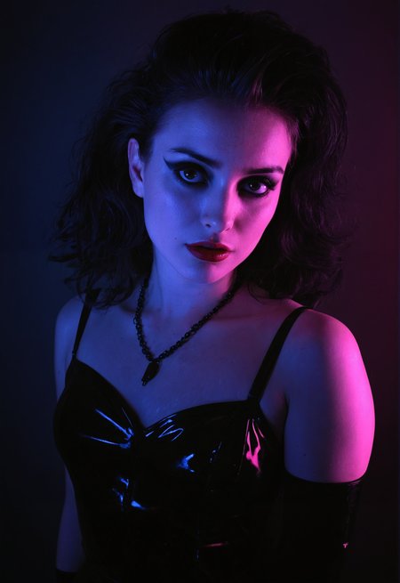 young goth woman, pale skin, 20 years old, (freckles:0.6), (dramatic lighting:0.8), mascara, the cure, 1980s, vintage, neon lighting, rembrandt lighting, noir, pinup, portrait