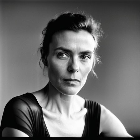 kiev80 A stunning, high-end black-and-white portrait of an elegant woman, captured with masterful chiaroscuro lighting. Her face is the absolute focal point, radiating depth, emotion, and a captivating presence. Every detail—her eyes, the subtle texture of her skin, and the gentle curve of her lips—is illuminated with a perfect interplay of light and shadow, creating a sculptural, timeless aesthetic. The background is minimalist and softly blurred, ensuring an undistracted focus on her expression and the contours of her features. The photograph embodies a cinematic, almost ethereal quality, reminiscent of the legendary works of Helmut Newton, Peter Lindbergh, and Richard Avedon. The composition is meticulously balanced, exuding sophistication, mystery, and a refined artistic vision, making it a true masterpiece of portrait photography.
