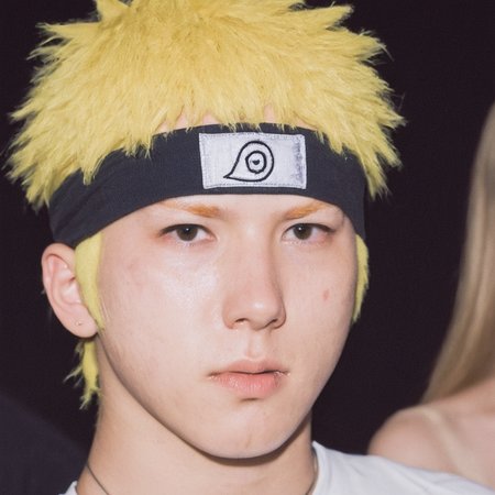 portrait photograph of Naruto Uzumaki with whiskers wearing a ninja headband watching a concert, Zenit 35mm