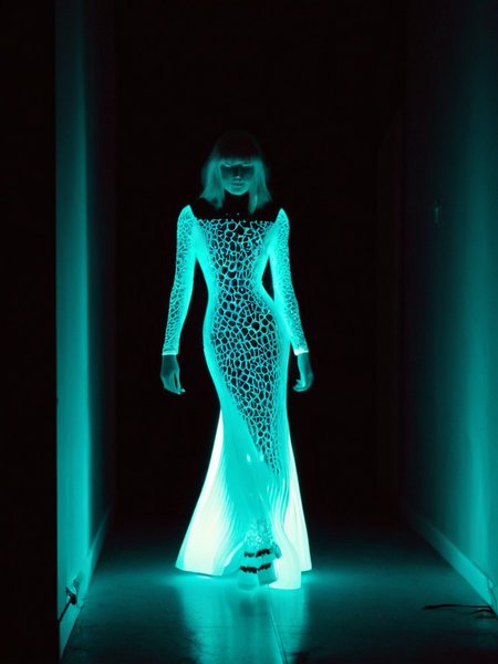 Cinematic fashion photograph  Adeera_Addams_P_MXAI_SDXL , sly expression, walking through a dark room, wearing a long (((real-bioluminescent-glowing-style))) dress,