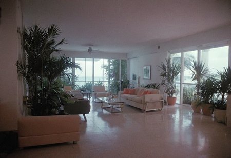analog film photo MiamiVice, indoors . faded film, desaturated, 35mm photo, grainy, vignette, vintage, Kodachrome, Lomography, stained, highly detailed, found footage