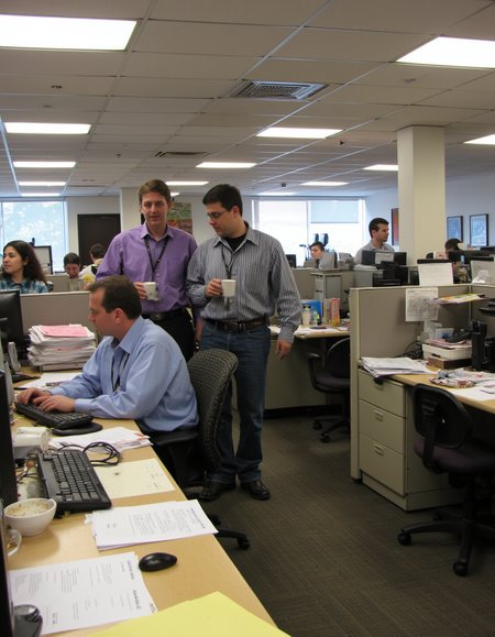 Realistic scene of a 90s mega corporation office, 90s computers, cubicles, fluorescent lighting,  carpeted flooring,  paperwork, cluttered, messy,  office workers standing drinking coffee and laughing with their co-workers, 
 <lora:amateurphoto-6version:1> Amateur photography of               , on flickr in 2007, 2005 blog, 2007 blog ,