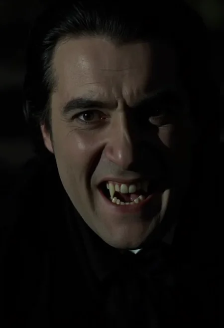 close-up face shot of an aristocratic vampire man sneering showing fangs, face filling the whole frame. Pale skin, dark clothes, dark hair, neutral black background. Low light at night   <lora:hammer-000073:1>