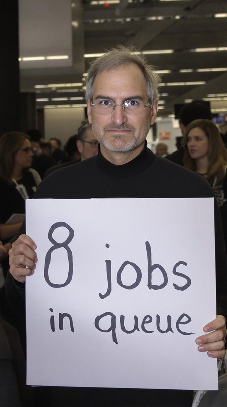 Steve Jobs is waiting in line with a sad face. Looking at viewer. holding a sign with words "8 jobs in queue". Crowded