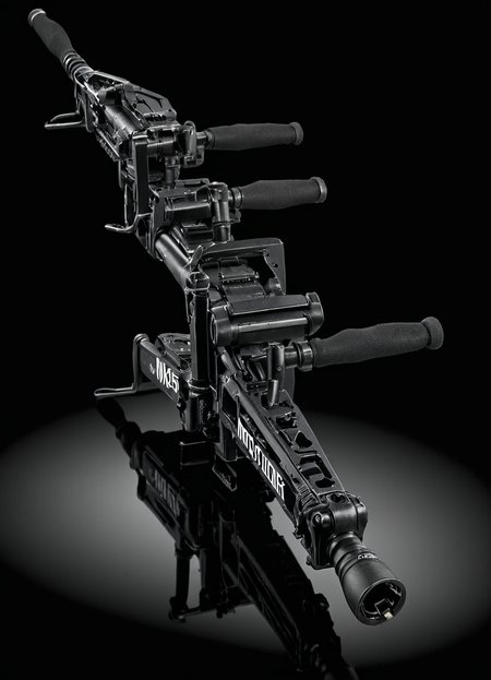 product advertisment photo of a m56smrt weapon, text "More Power!" in bold letters, displayed on a glass surface, refelctions, glossy, dark background,
 <lora:M56_Smartgun_-_Aliens_SDXL:1>