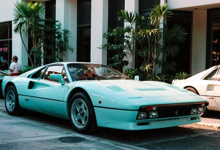 ClassicSportsCar MiamiVice, gleaming pastel Ferrari 288, 4K, highly detailed, (((stylish grainy analog 35mm film photo)))