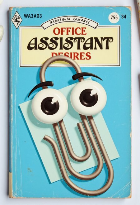 a Harlequin romance book cover with the title "OFFICE ASSISTANT DESIRES" with clippy the paperclip with big eyes