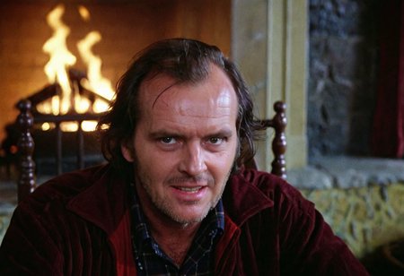 Jack Torrance, closeup, crazy evil look, powerful, Overlook Hotel, lounge, fireplace in background, indoors, highly detailed, 4K, ((grainy 35mm photo))