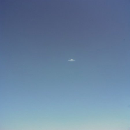 (olddigitalcamera, raw, light leak, film grain, jpeg artifacts, low res, low quality):2, distant UFO, flying saucer, hovering in the sky, far away