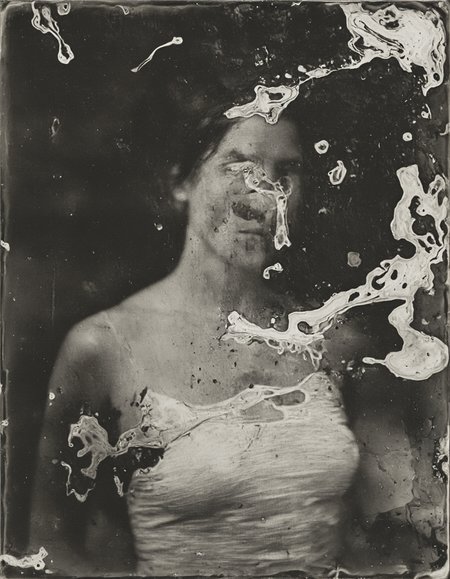 wetplatecollodion photo of woman wearing bodycon dress,
border, swirls, washed out, textured, smears, muted colors