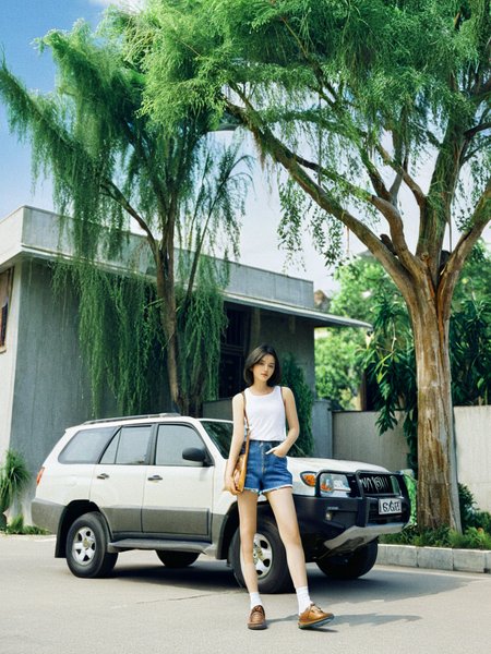 jiFilm,1girl,shorts,realistic,outdoors,denim,solo,ground vehicle,building,shirt,car,denim shorts,motor vehicle,street,black hair,sleeveless,day,tree,sky,short hair,<lora:20240611-1718040971673:1>,(masterpiece, best quality, highres:1.2),, (masterpiece, best quality, highres:1.2),
