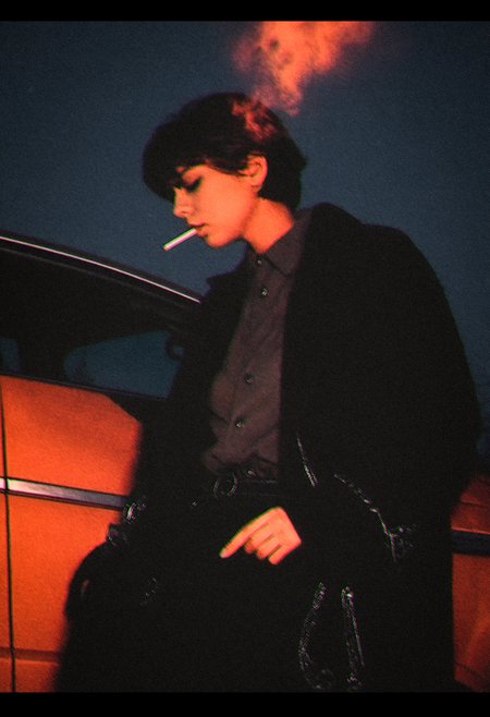 amateur photo, 
(film grain:1.0), polaroid photo, 
outdoors, car, smoking cigarette, short hair, coat, black and white, low angle, closed eyes, moonlight, witchcore, abstract, chromatic aberration, 
best quality, normal aesthetic,  very detailed, intricate details, photorealistic, realistic,
<lora:leaked_nudes_style_v1_fixed:1>