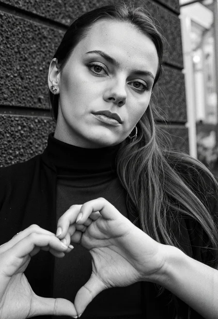 <lora:dafne-keen-dev2pro-lora:1>,DK woman,,Making a heart sign,Liechtenstein,Ilford XP2 400,Agfa Vista