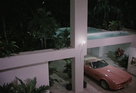 analog film photo MiamiVice, indoors . faded film, desaturated, 35mm photo, grainy, vignette, vintage, Kodachrome, Lomography, stained, highly detailed, found footage