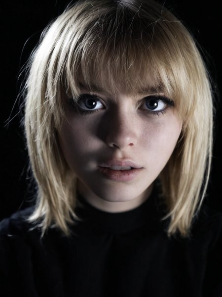 Cinematic fashion photograph  Adeera_Addams_P_MXAI_SDXL , flirty expression, extreme closeup shot, black background,