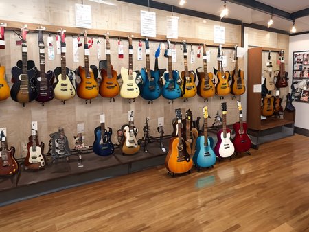 masterpiece, best quality, ultra-detailed, illustration,
(2girls:1.4), school uniform,  school bag,  smile ,
guitarshop, guitar, instrument, electric guitar, bass guitar, amplifier, gibson les paul, drum, acoustic guitar, speaker, wooden floor, indoors, 
 <lora:guitarshop:0.8>