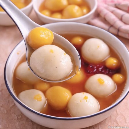 For a realistic style image of a spoon with some food in it,<lora:Tang_yuan:0.85>,paste jam   filling,