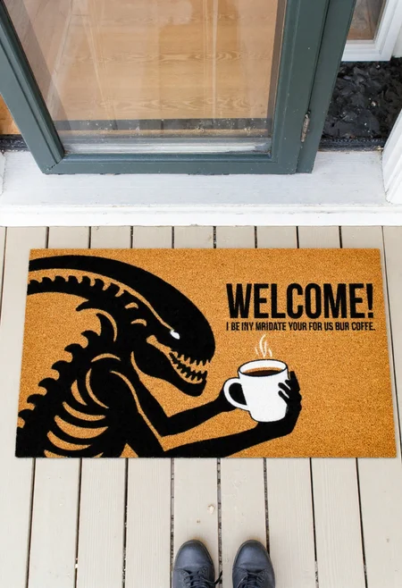 <lora:Welcome_Mat_Manufacturer_FLUX-000023:0.9>  
The image is a photograph of a small outdoor entrance area, featuring a doormat with a humorous design. The doormat is rectangular and made of a textured, brown, coir material. It has a vibrant, whimsical design featuring a black xenomorph holding a cup of coffee and  text "WELCOME!"